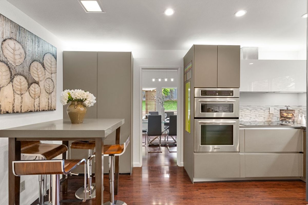 Modern kitchen with breakfast bar and view to the dining room