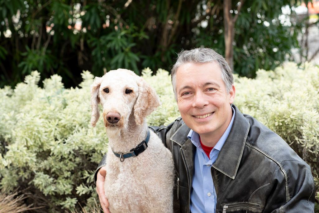 Tomas Kandl with Axel, the family poodle